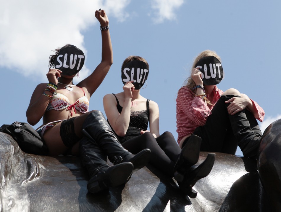 Slut 117269-women-sit-on-a-lion-in-trafalgar-square-during-a-rally-after-slutwalk-